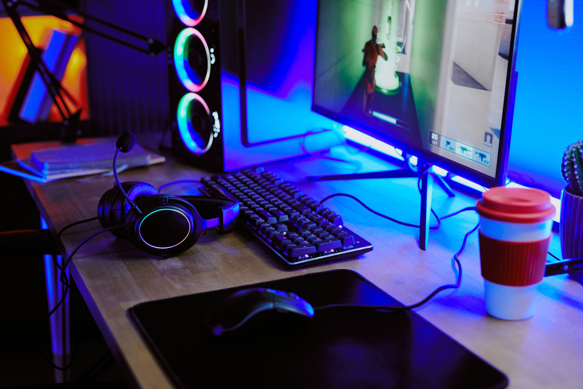 Teenager Live Streaming Video Game on Desktop Computer with Gaming Headset